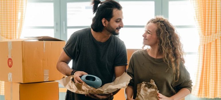 A man and woman waiting for interstate movers Maryland